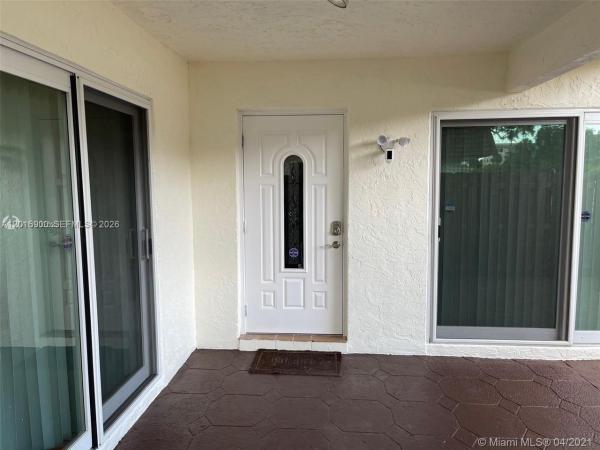 Willow Wood Townhomes, 7913 Tam Oshanter Blvd, North Lauderdale, Florida 33068, image 1