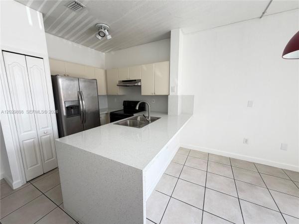 Shoma Homes At Country Club, 7080 NW 177th St #209-13, Hialeah, Florida 33015, image 1