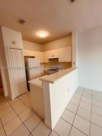 Shoma Homes At Country Club, 7080 NW 177th St #201-13, Hialeah, Florida 33015, image 1
