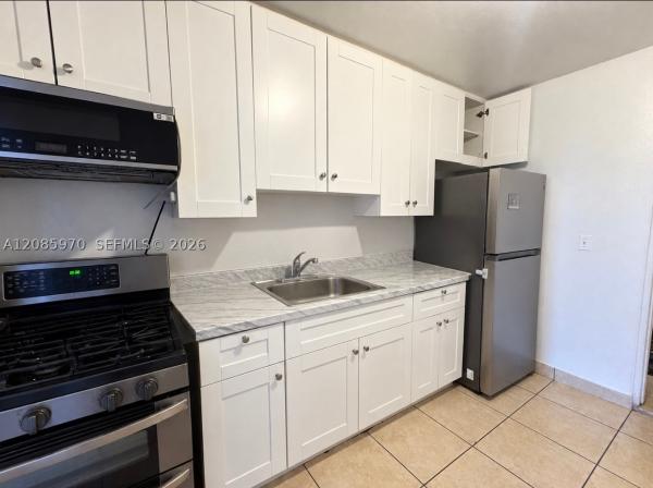 Sun Tan Village, 1010 E 8th Ct, Hialeah, Florida 33010, image 1