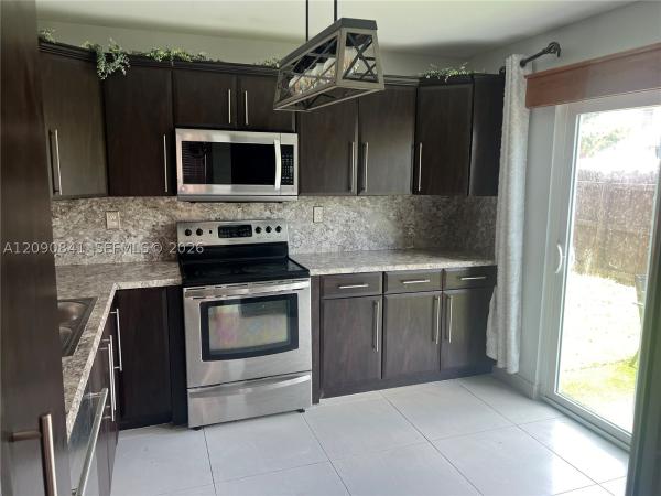 Villas At Woodland Greens, 5788 Woodland Point Dr, Tamarac, Florida 33319, image 1