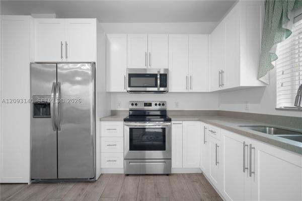 Comfort Gardens, 836 NW 33rd Ave, Miami, Florida 33125, image 1