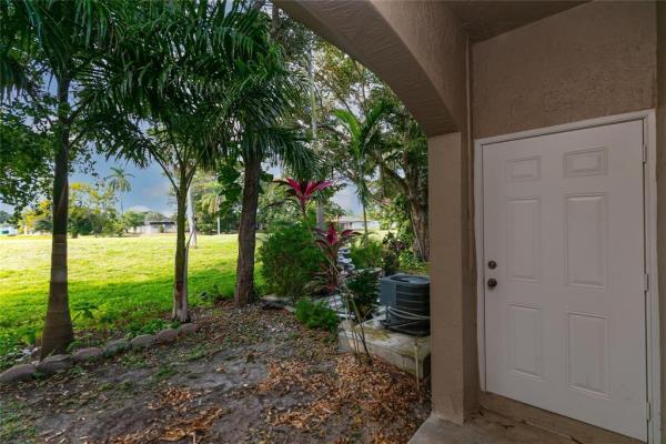 The Woodlands Villas, 4408 Woodland Cir, Tamarac, Florida 33319, image 1