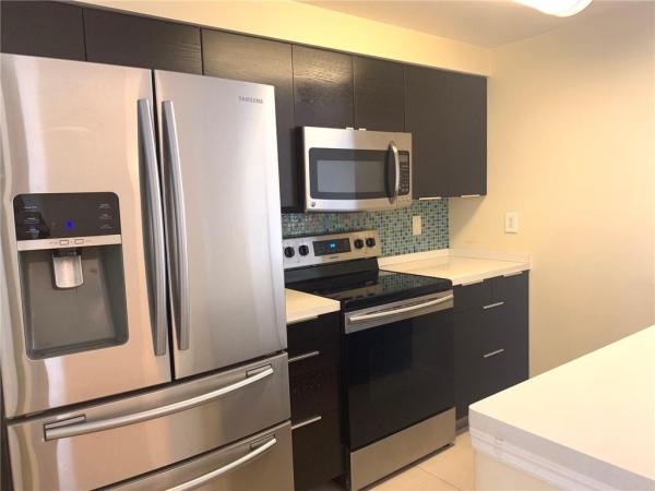 Poinciana Place, 5980 W Sample Rd #303, Lake Worth, Florida 33067, image 1