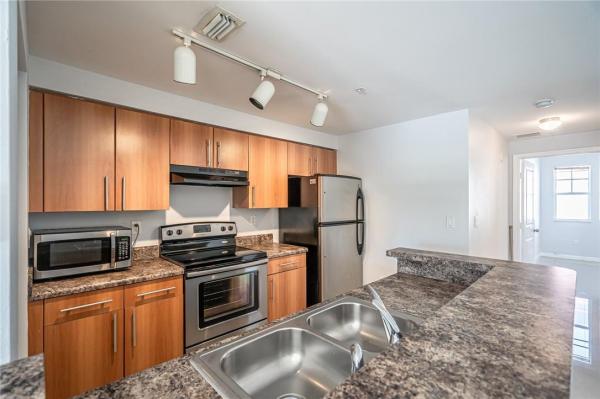 Poinciana Place, 5860 W Sample Rd #304, Lake Worth, Florida 33067, image 1