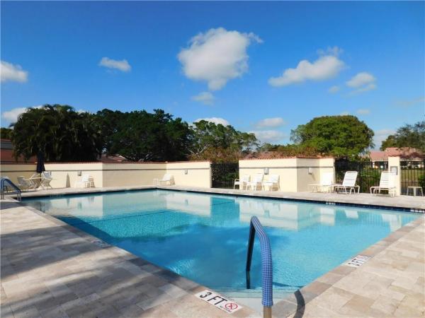 Villas On The Green, 2581 Deer Creek Emerald Way N, Deerfield Beach, Florida 33442, image 1
