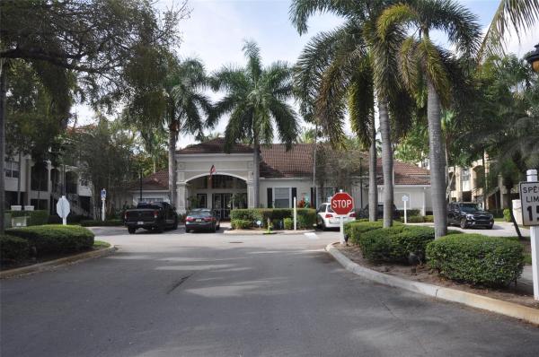 Poinciana Place, 5900 W Sample Rd #203, Lake Worth, Florida 33067, image 1
