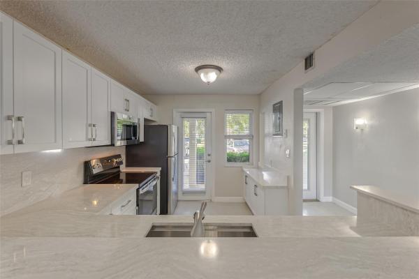 Palm Aire At Coral Key, 3150 NE 48th Ct #102, Hillsboro Beach, Florida 33064, image 1