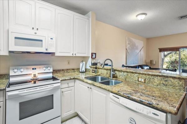 The Woodlands Villas, 4411 Woodland Cir, Tamarac, Florida 33319, image 2