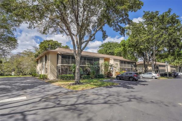 Hidden Woods Of Deer Creek, 147 Deer Creek Blvd #402, Deerfield Beach, Florida 33442, image 1