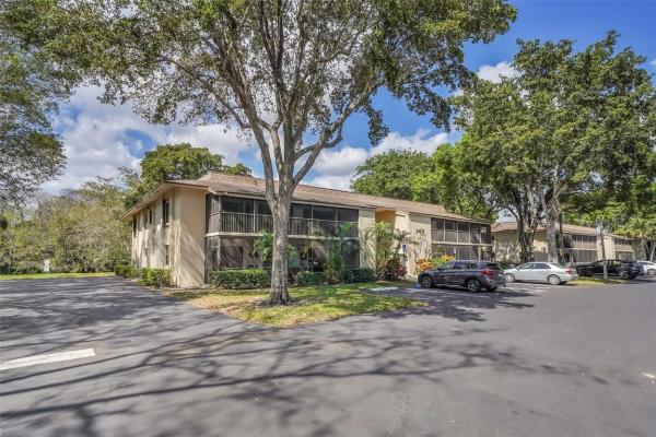 Hidden Woods Of Deer Creek, 147 Deer Creek Blvd #402, Deerfield Beach, Florida 33442, image 1