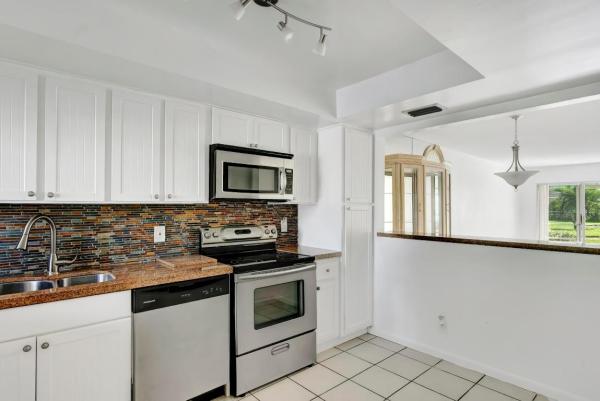 Poinciana Gardens At Poinciana Place, 3212 Strawflower Way #106, Lake Worth, Florida 33467, image 2