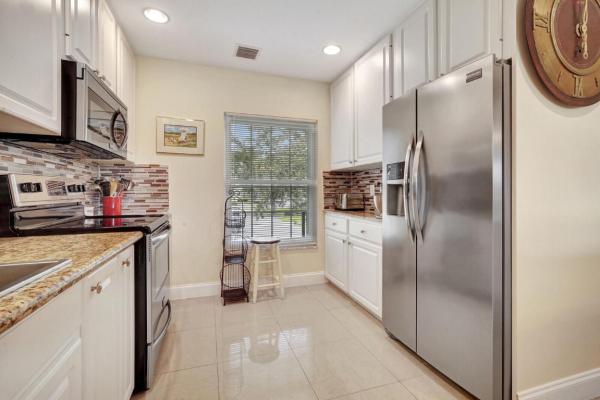 Riverbend Country Club, 18429 SE Wood Haven Ln #H, Jupiter, Florida 33469, image 1