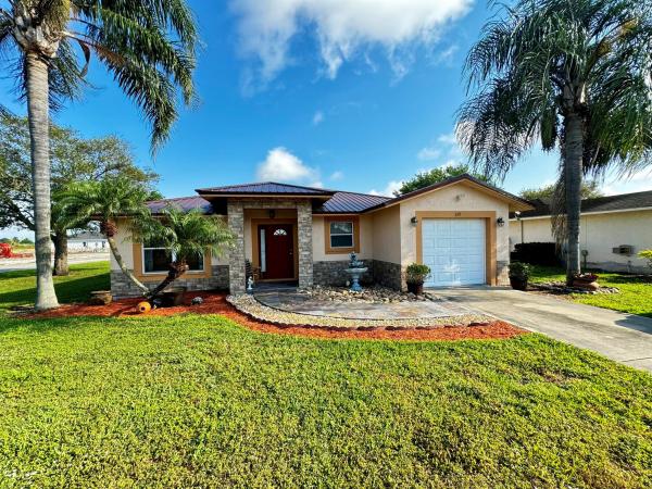 Hillsboro Estates, 139 Dabou Loop, Belle Glade, Florida 33430, image 1