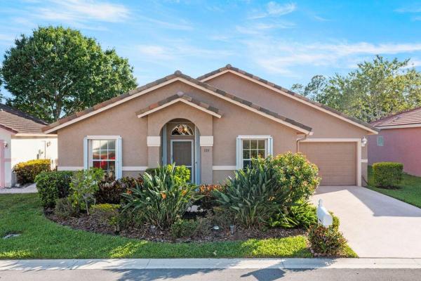 Caribe Isle At River Bridge, 124 Caribe Ct, Greenacres, Florida 33413, image 1