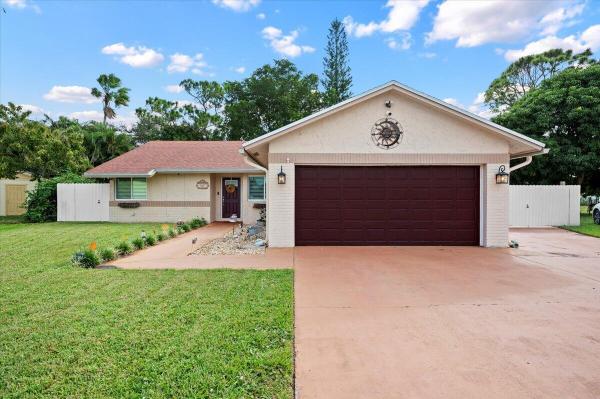 The Forest Homes, 487 Foresta Ter, West Palm Beach, Florida 33415, image 1