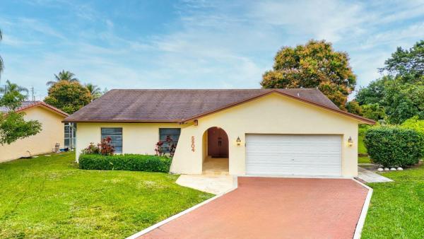The Woodlands, 5904 Blue Beech Ct, Tamarac, Florida 33319, image 1