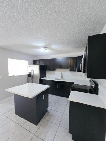 Westchester Townhouses, 4320 Woodstock Dr #D, West Palm Beach, Florida 33409, image 1