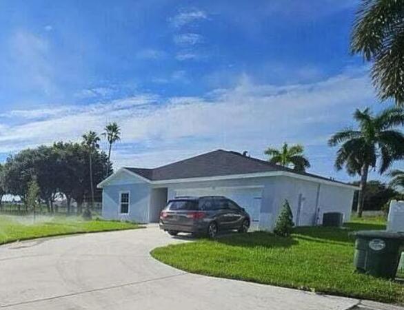 Hillsboro Estates, 136 Dabou Loop, Belle Glade, Florida 33430, image 1