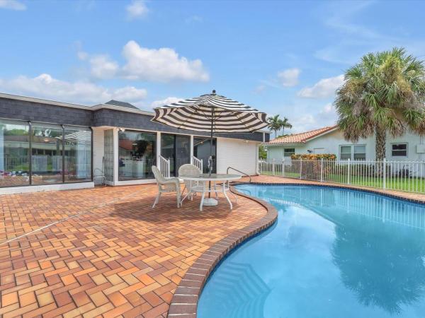 The Woodlands, 5310 Mango Cir, Tamarac, Florida 33319, image 1