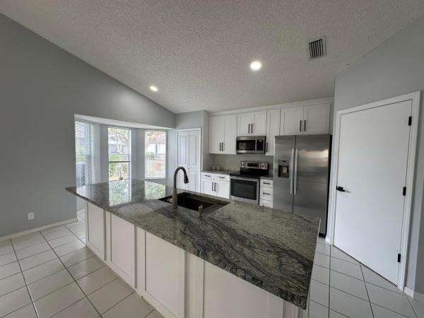 The Hammocks At River Bridge, 119 Hammocks Ct, Greenacres, Florida 33413, image 1